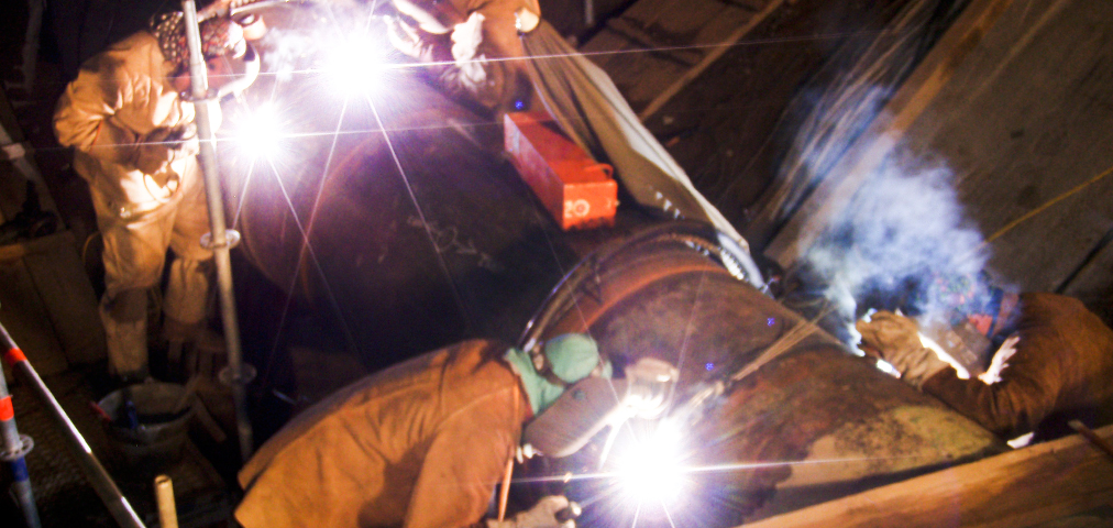 Welding experts integrating the pipeline